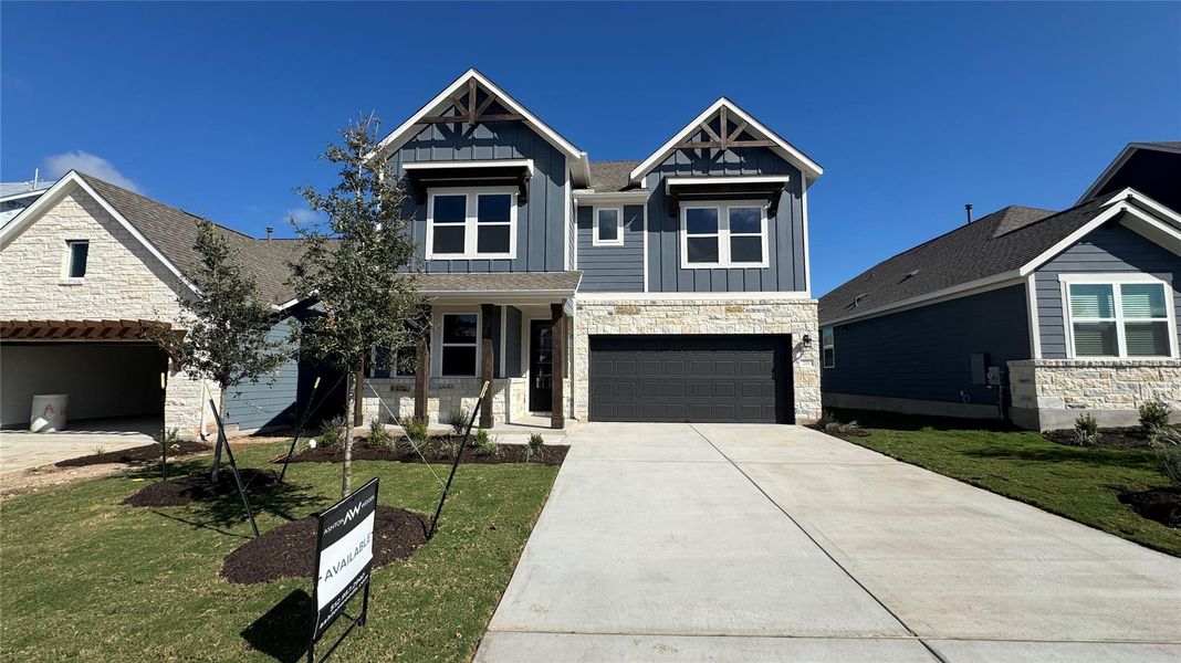 Front exterior of a new home in Cannon Ranch 45s, Dripping Springs, TX, highlighting curb appeal (Image 1). Front exterior of a new home in Cannon Ranch 45s, Dripping Springs, TX, highlighting curb appeal (Image 1).