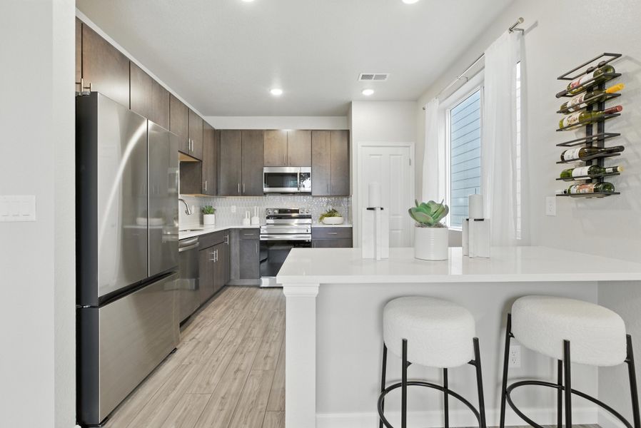 Representative furnished interior of a home built from the Denali by Risewell Homes in Spring Valley, Longmont (Image 4).