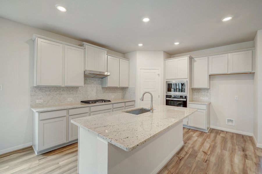 Kitchen in the Pearl floorplan at a Meritage Homes community.