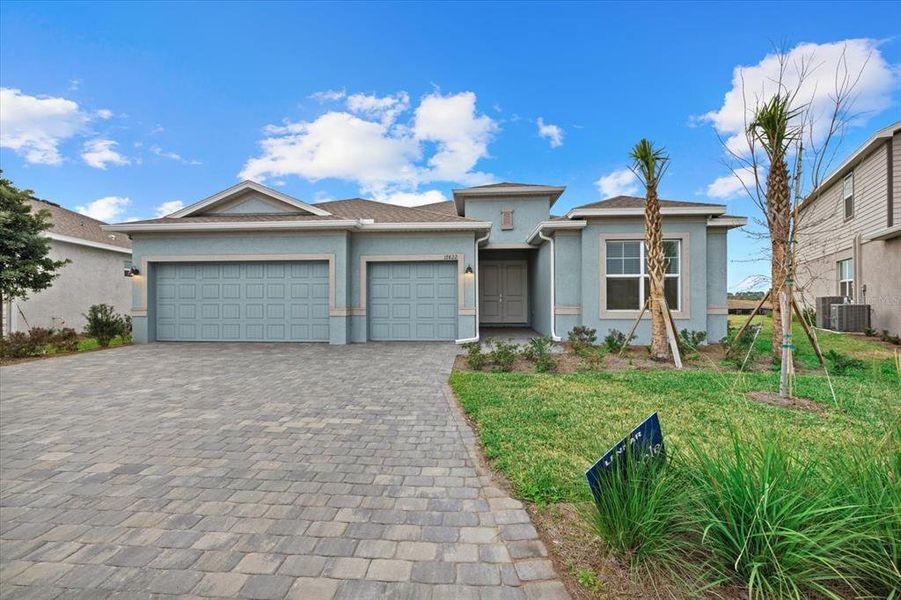Front exterior of a new home in Rye Ranch, Parrish, FL, highlighting curb appeal (Image 26).