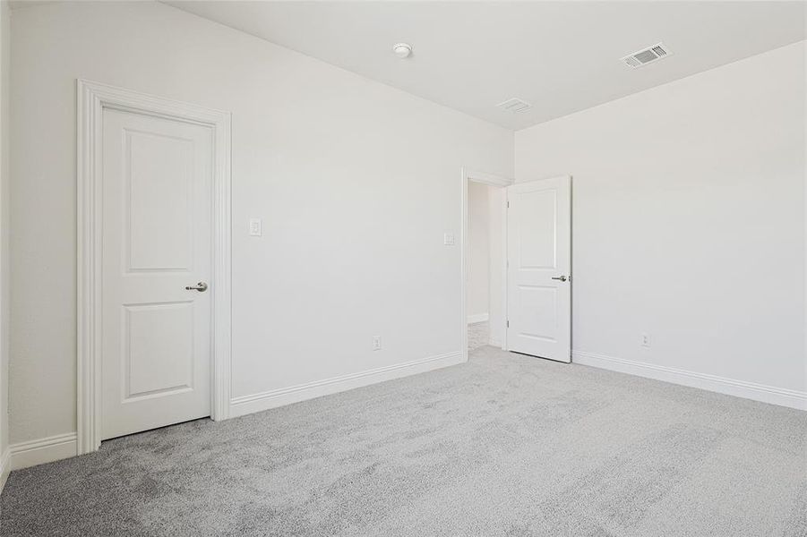 Empty room with carpet flooring