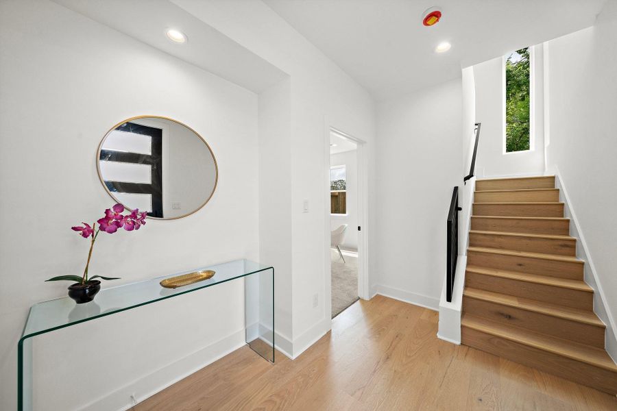 Step into a welcoming entryway that sets the tone for the rest of the home with its clean lines, abundant natural light, and inviting atmosphere. The space features a modern front door, tasteful flooring, and a seamless flow into the house—offering a perfect first impression Step into a welcoming entryway that sets the tone for the rest of the home with its clean lines, abundant natural light, and inviting atmosphere. The space features a modern front door, tasteful flooring, and a seamless flow into the house—offering a perfect first impression