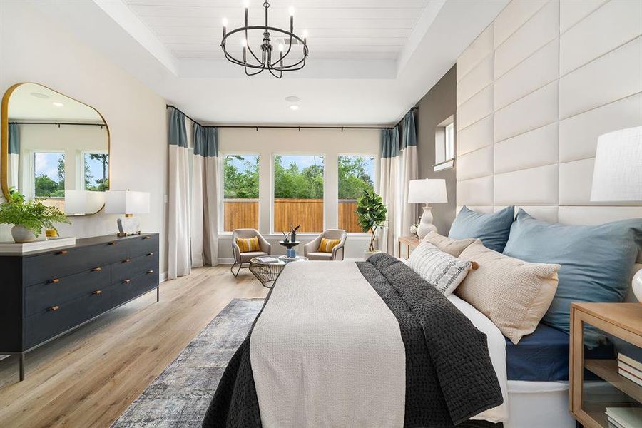 Vinyl plank floors and shiplap at treyed ceiling compliment this beautiful Master suite!