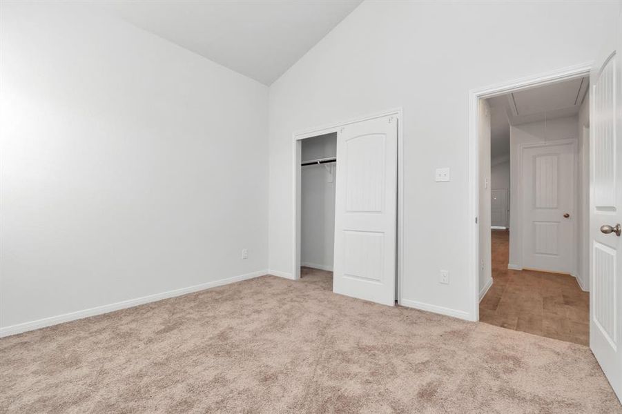 This bedroom invites comfort with soft carpet flooring and an abundance of natural light pouring in. A blank canvas ready for personalization to create your own retreat. **This image is from another Saratoga Home - Clover floorplan.**