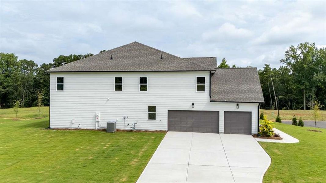 Front exterior of a new home in Holland Estates, Powder Springs, GA, highlighting curb appeal (Image 31).