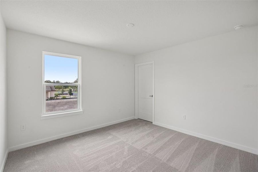 Spacious, unfurnished interior of a new home in Grasslands West, Lakeland (Image 34).