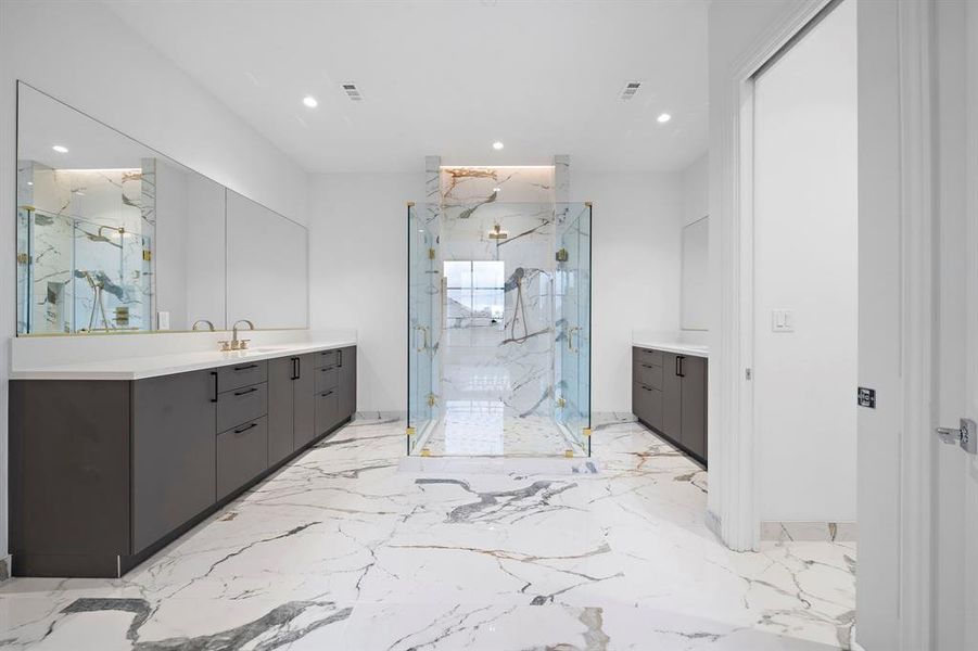 Primary bath: Beautiful stonework adds a refined touch to the primary bath