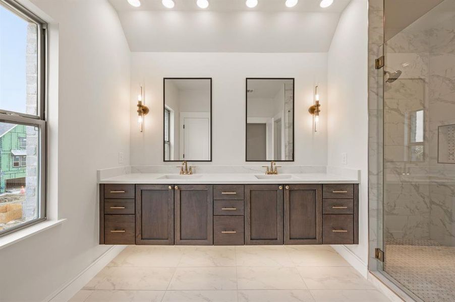 Featuring a beautiful contemporary design and the perfect amount of space for two, this owner's bath is a dream come true! Featuring a beautiful contemporary design and the perfect amount of space for two, this owner's bath is a dream come true!