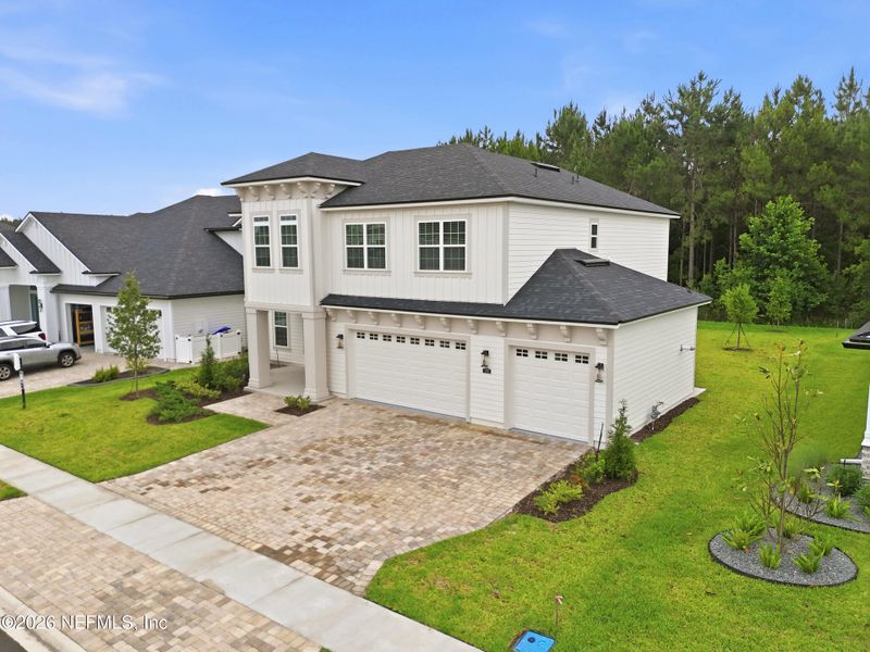 Front exterior of a new home in Silver Landing At Silverleaf, St. Augustine, FL, highlighting curb appeal (Image 25).