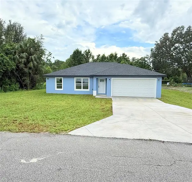Front exterior of a new home in , Ocala, FL, highlighting curb appeal (Image 2). Front exterior of a new home in , Ocala, FL, highlighting curb appeal (Image 2).