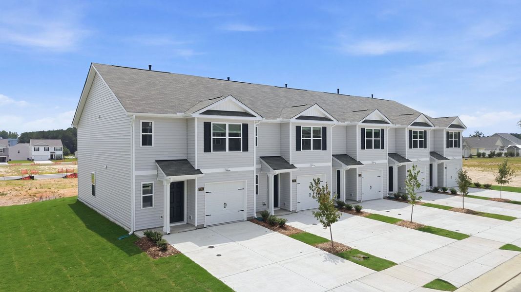 Front exterior of a new home in The Townes at Hunter Hill, Rocky Mount, NC, highlighting curb appeal (Image 23).