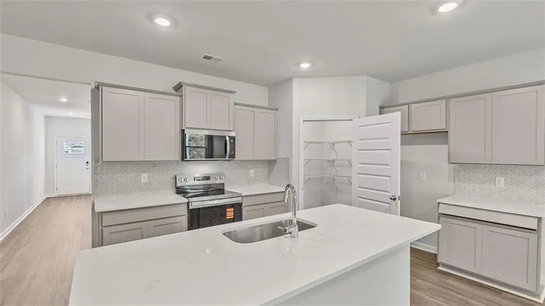 Furnished interior view inside a new home in Teamon Pointe, Griffin (Image 3).