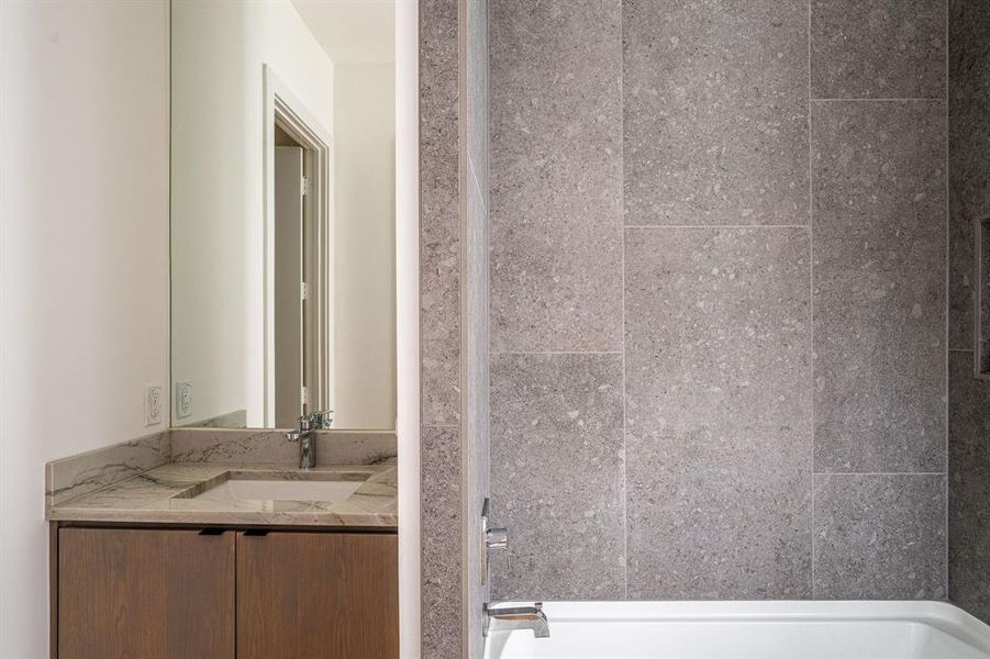 Bathroom with washtub / shower combination and oversized vanity Bathroom with washtub / shower combination and oversized vanity