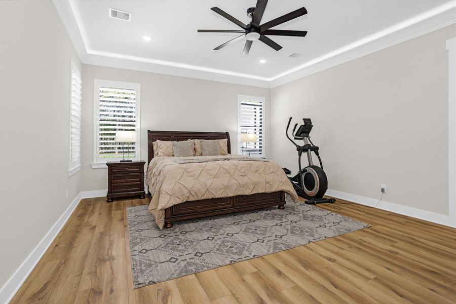 Large primary bedroom with natural light