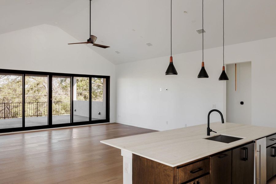 The upstairs game room includes a built-in bar with custom cabinetry, creating an ideal space for entertaining. The upstairs game room includes a built-in bar with custom cabinetry, creating an ideal space for entertaining.