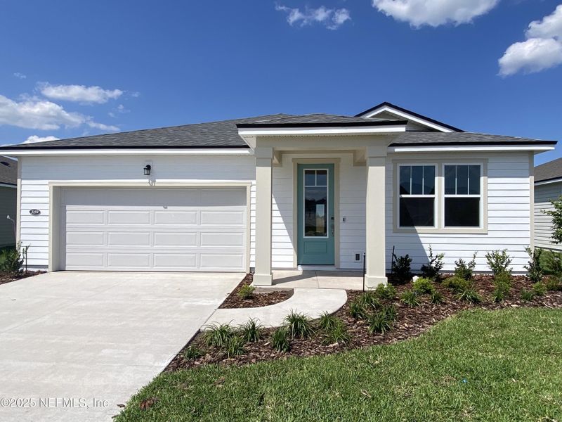 Front exterior of a new home in Lakes at Bella Lago, Green Cove Springs, FL, highlighting curb appeal (Image 1).
