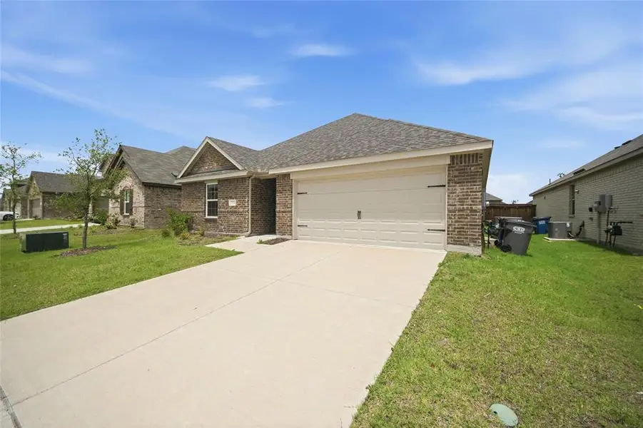 Front exterior of a new home in , Forney, TX, highlighting curb appeal (Image 1). Front exterior of a new home in , Forney, TX, highlighting curb appeal (Image 1).