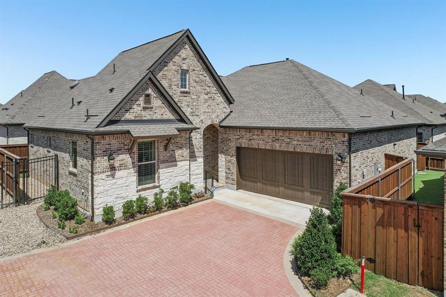 Front exterior of a new home in Elements at Viridian - Garden Series, Arlington, TX, highlighting curb appeal (Image 2). Front exterior of a new home in Elements at Viridian - Garden Series, Arlington, TX, highlighting curb appeal (Image 2).