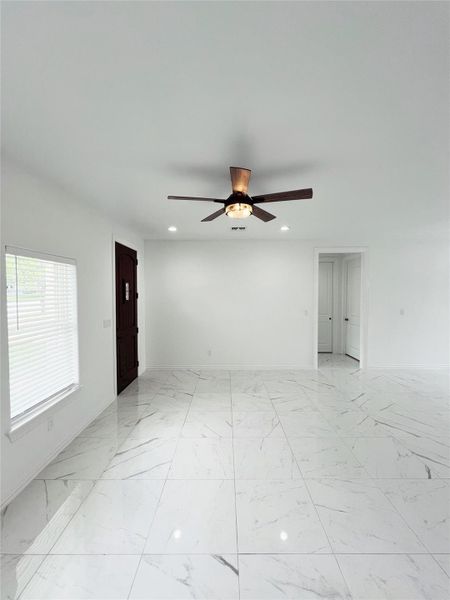Unfurnished room featuring a ceiling fan, baseboards, recessed lighting, and marble finish floor Unfurnished room featuring a ceiling fan, baseboards, recessed lighting, and marble finish floor