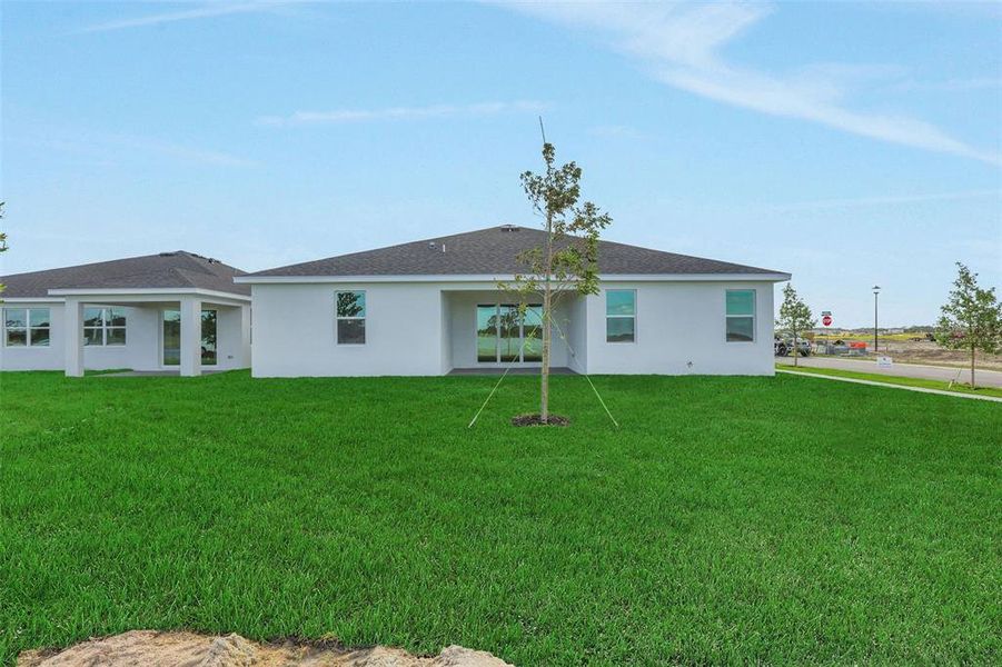 Exterior details and patio area of a home in Brystol North at Wylder, Port St. Lucie (Image 4).