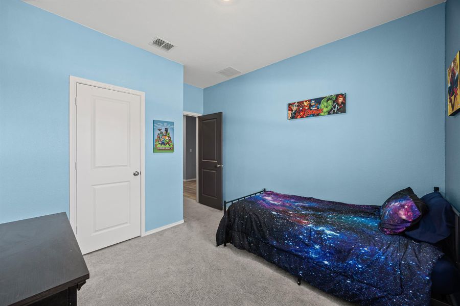 Bedroom 2 with carpet flooring and baseboards Bedroom 2 with carpet flooring and baseboards