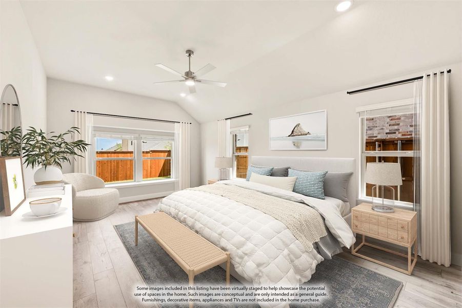 Spacious master bedroom with vaulted ceiling, ceiling fan, light wood floors, and multiple windows Spacious master bedroom with vaulted ceiling, ceiling fan, light wood floors, and multiple windows