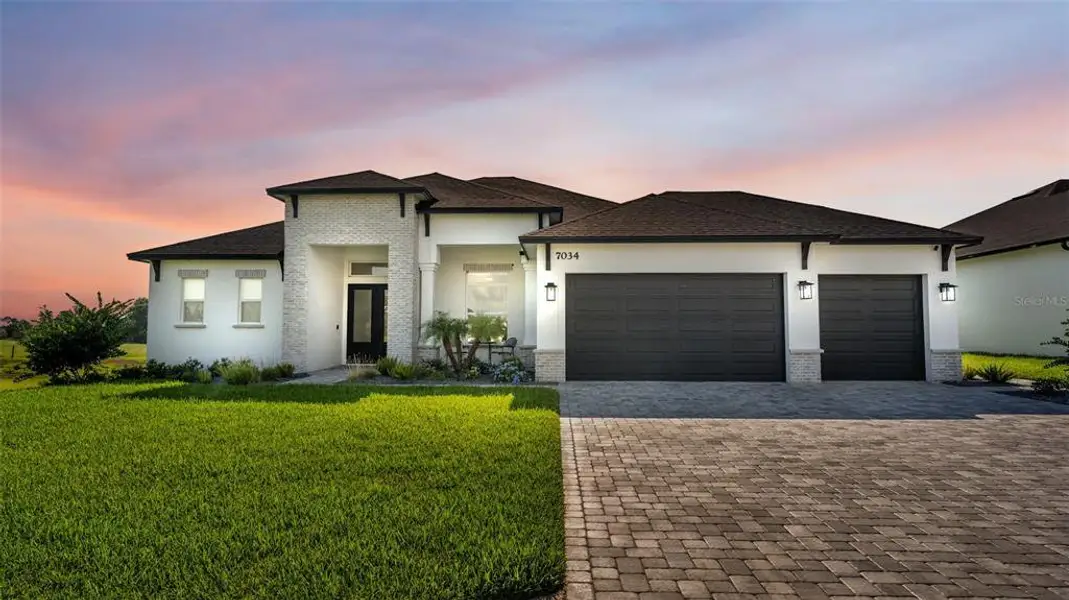 Front exterior of a new home in , Lakeland, FL, highlighting curb appeal (Image 1). Front exterior of a new home in , Lakeland, FL, highlighting curb appeal (Image 1).