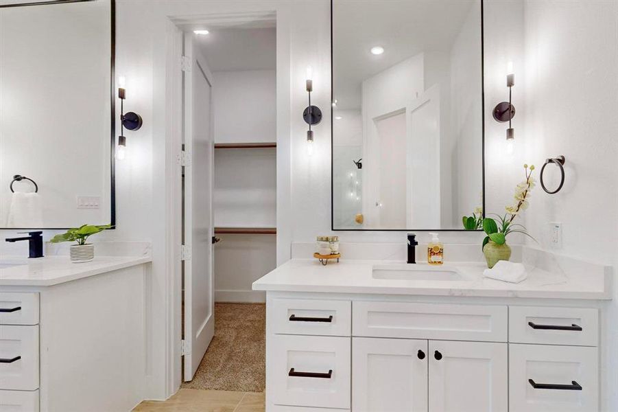 Bathroom featuring tile patterned flooring and vanity