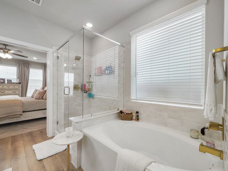 Unwind in the soaking tub or enjoy the separate shower—creating a relaxing space to recharge at the end of the day.