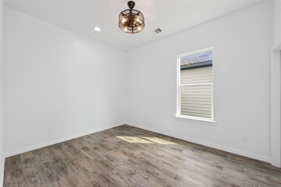 Spacious bedroom with easy access to the shared bathroom.