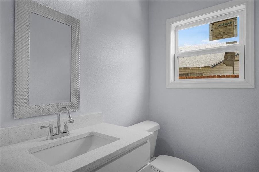 Half bath with toilet and vanity