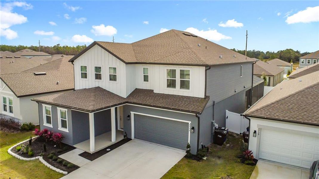 Front exterior of a new home in Sunbrooke, St. Cloud, FL, highlighting curb appeal (Image 29).