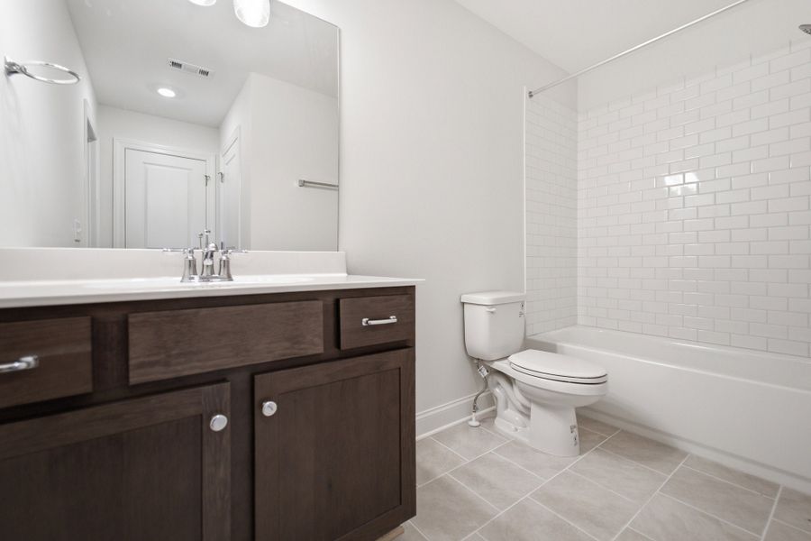 Furnished interior view inside a new home in Aden Woods, Fairview (Image 12).
