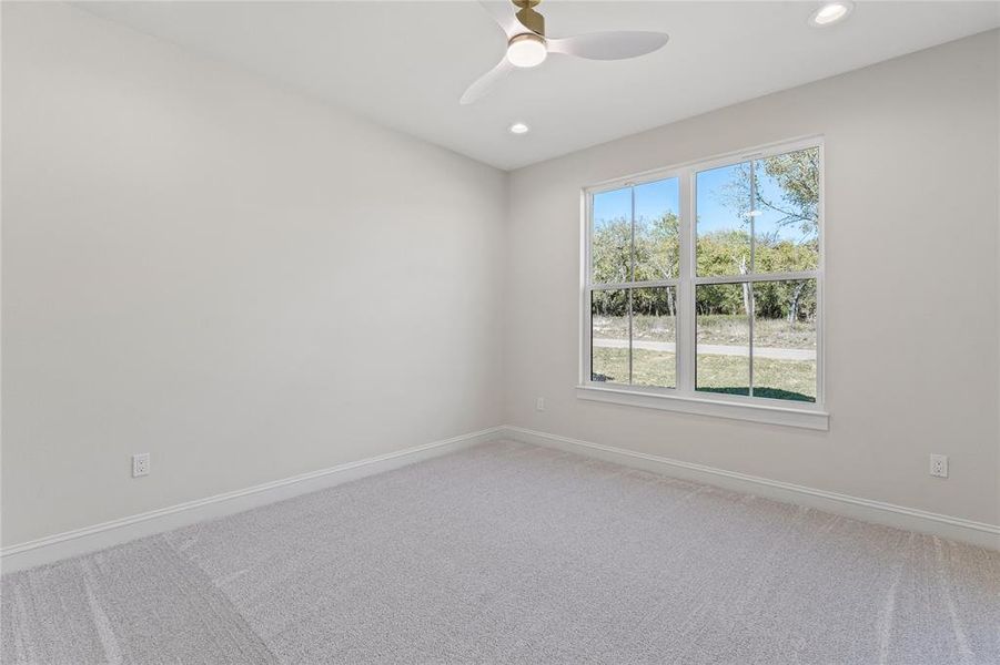 Spare room with carpet flooring, recessed lighting, and ceiling fan