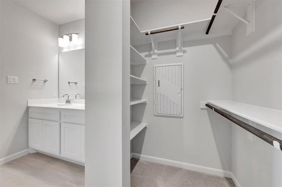 Walk-in closet with integrated shelving and hanging rods