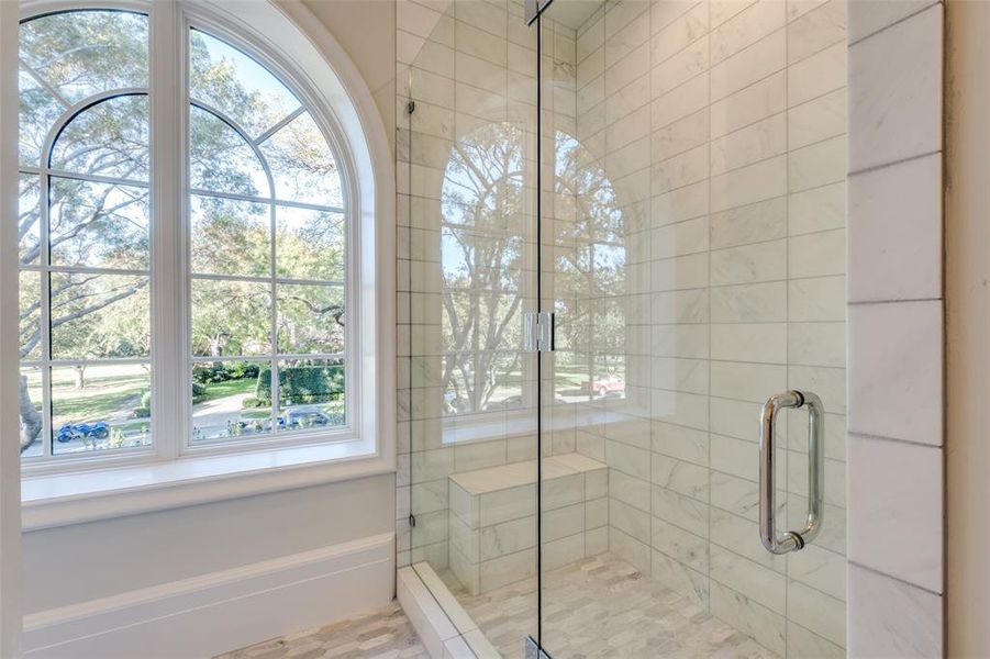 Bathroom with a shower with shower door