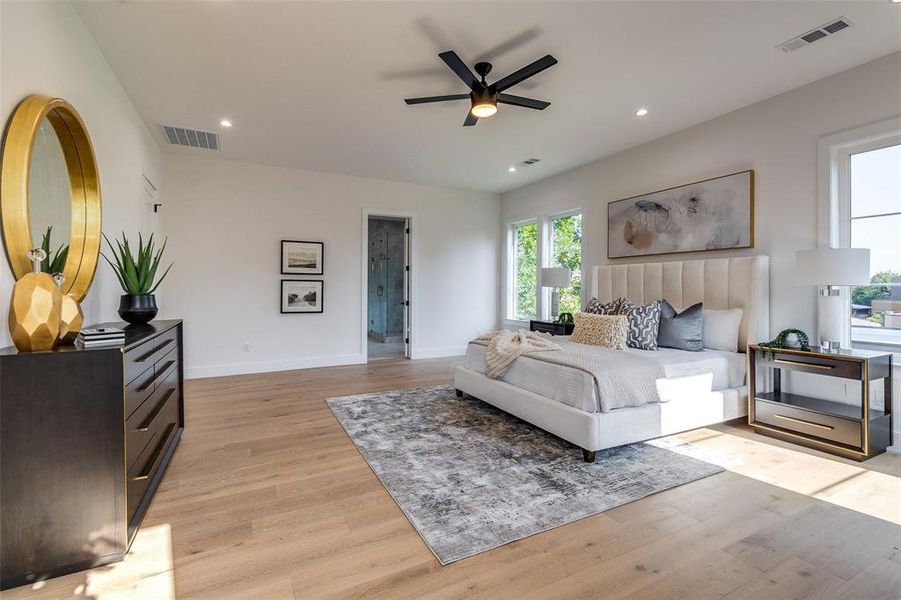 Bedroom featuring light hardwood / wood-style flooring and ceiling fan