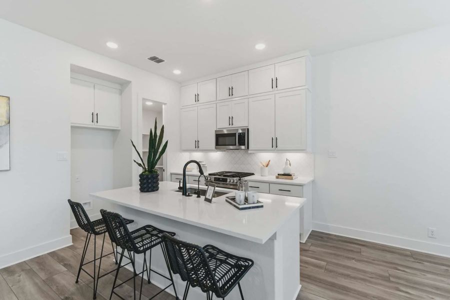 Representative furnished interior of a home built from the Balder by Chesmar Homes in Prominence Urban, San Antonio (Image 5).