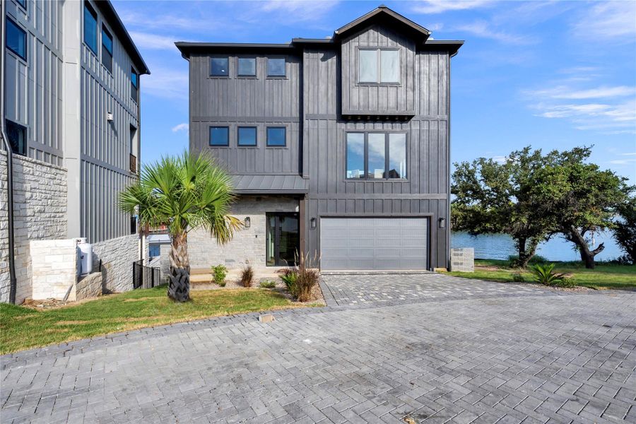 Front exterior of a new home in , Marble Falls, TX, highlighting curb appeal (Image 1).