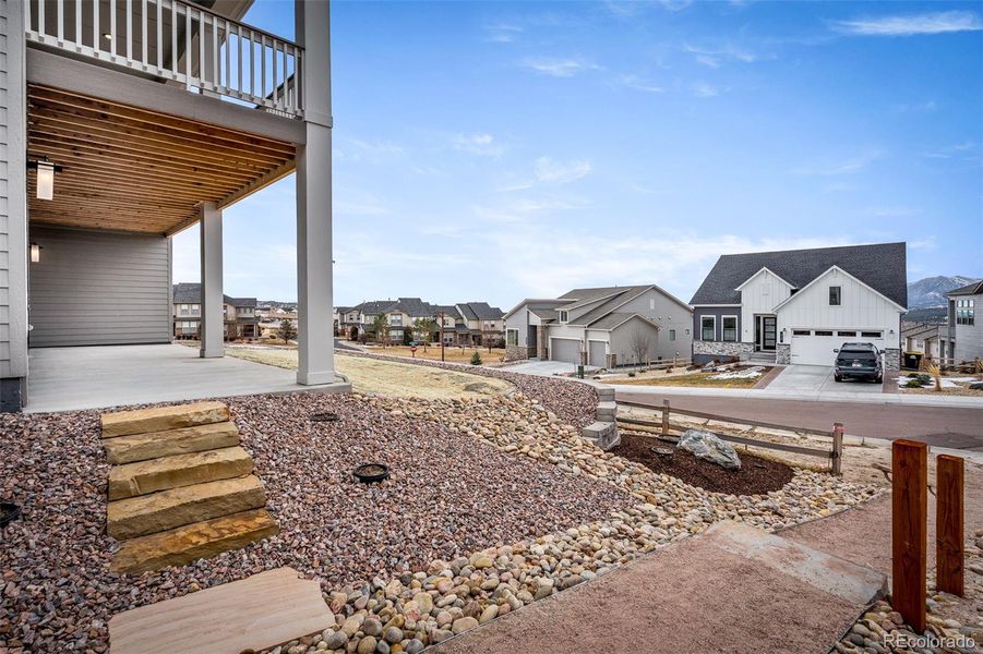 Exterior details and patio area of a home in Cloverleaf - Pinnacle Collection, Monument (Image 27).