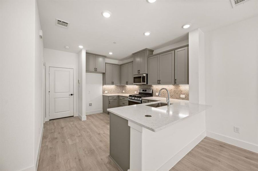 The kitchen of your dreams features fantastic storage, plenty of prep space and a breakfast bar that can do double duty as a homework station or place to grab a quick bite.