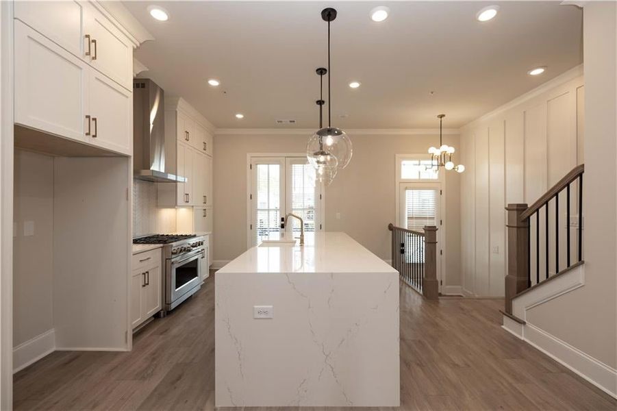 Front foyer entrance finished with upgraded trim detail, flows into your designer kitchen and entertaining space.