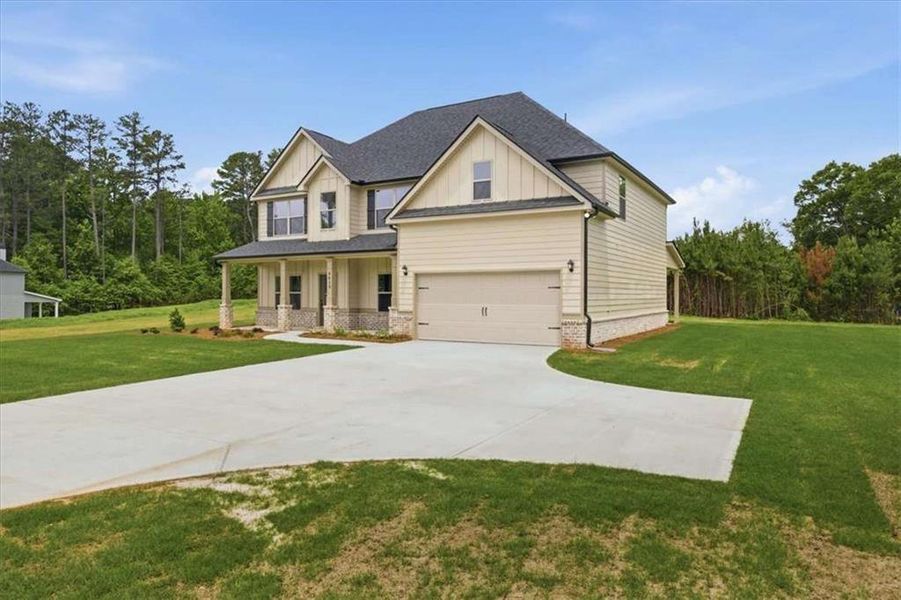 Front exterior of a new home in , Stockbridge, GA, highlighting curb appeal (Image 22).
