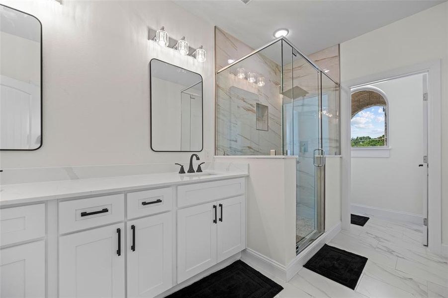 Bathroom with vanity and an enclosed shower