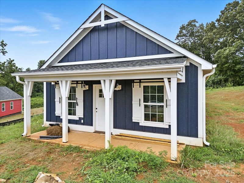 Front exterior of a new home in , Clover, SC, highlighting curb appeal (Image 26).