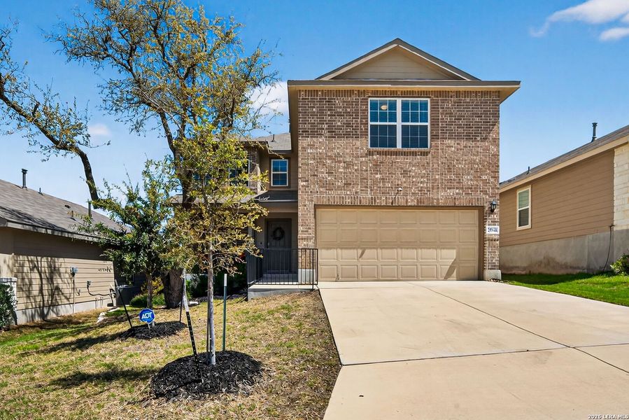 Front exterior of a new home in Copper Canyon, Bulverde, TX, highlighting curb appeal (Image 2). Front exterior of a new home in Copper Canyon, Bulverde, TX, highlighting curb appeal (Image 2).