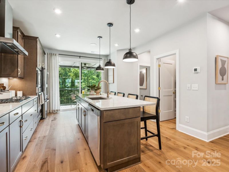 Large Central Island Ideal for Casual Dining. *Model Photos | Actual Finishes, Structural Selections, and Orientation May Vary. Large Central Island Ideal for Casual Dining. *Model Photos | Actual Finishes, Structural Selections, and Orientation May Vary.