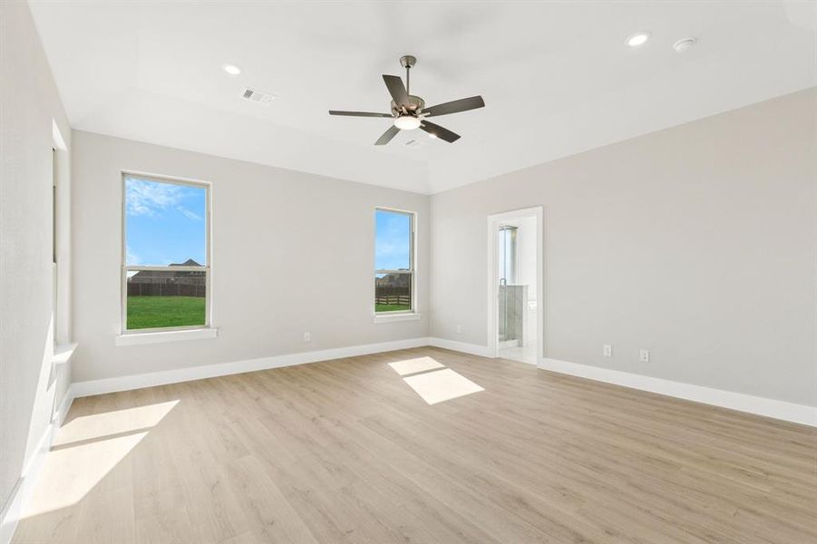 Spare room with light wood-type flooring, recessed lighting, and a ceiling fan Spare room with light wood-type flooring, recessed lighting, and a ceiling fan