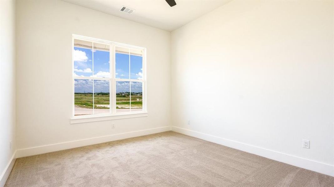 Unfurnished room featuring light colored carpet