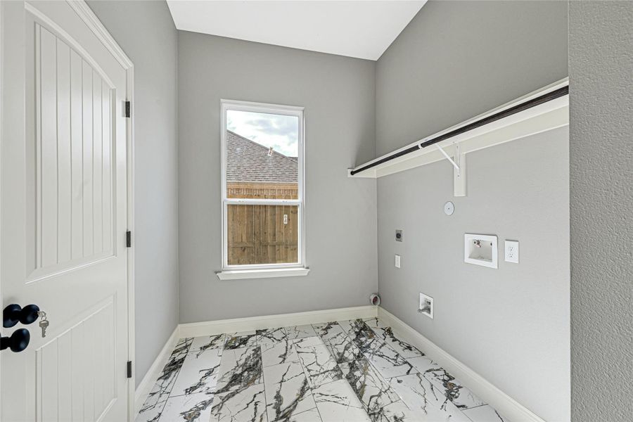 Utility room conveniently located near kitchen with plenty of room for laundry baskets. Lots of overhead storage with direct access to garage. Utility room conveniently located near kitchen with plenty of room for laundry baskets. Lots of overhead storage with direct access to garage.